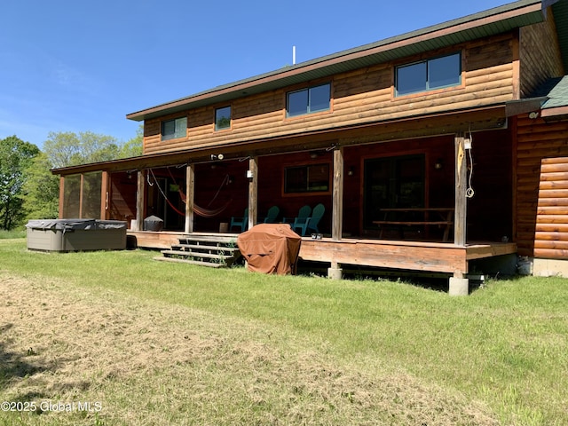 2158 Coach Rd, Argyle, NY 12809 - back of property with faux log siding, a yard, and a hot tub