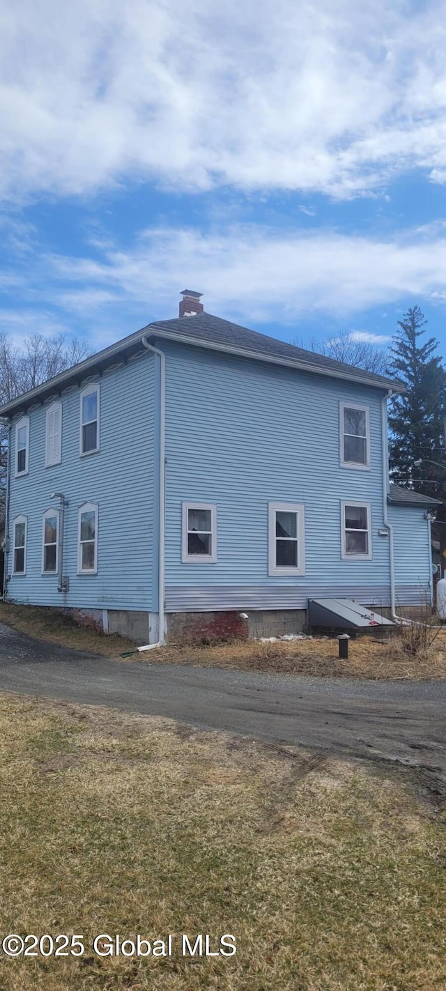 755 County Route 7, Schodack, NY 12063 - view of side of home with a yard and a chimney