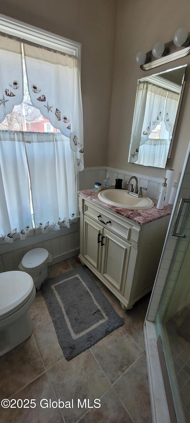 755 County Route 7, Schodack, NY 12063 - bathroom with tile patterned flooring, a stall shower, toilet, and vanity