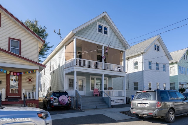view of front of property with a porch and a balcony