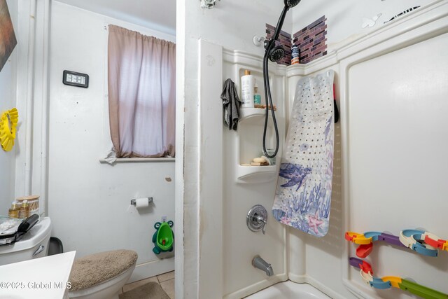 full bath featuring toilet and  shower combination