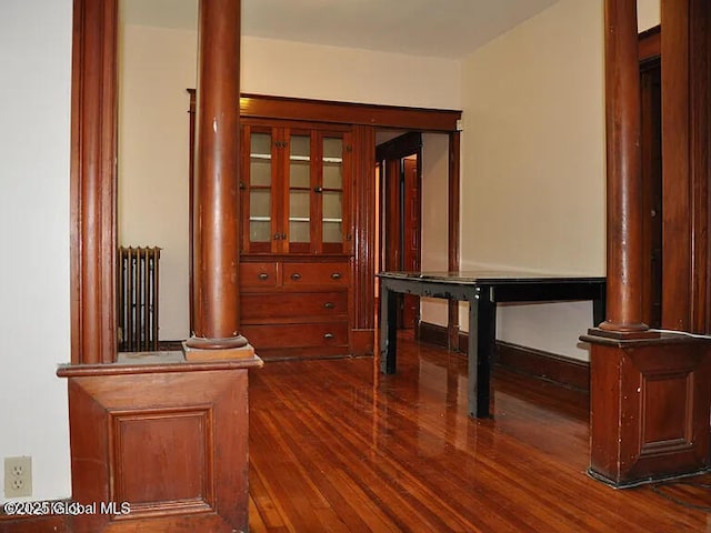 698 State St, Albany, NY 12203 - corridor with decorative columns and dark wood-style floors