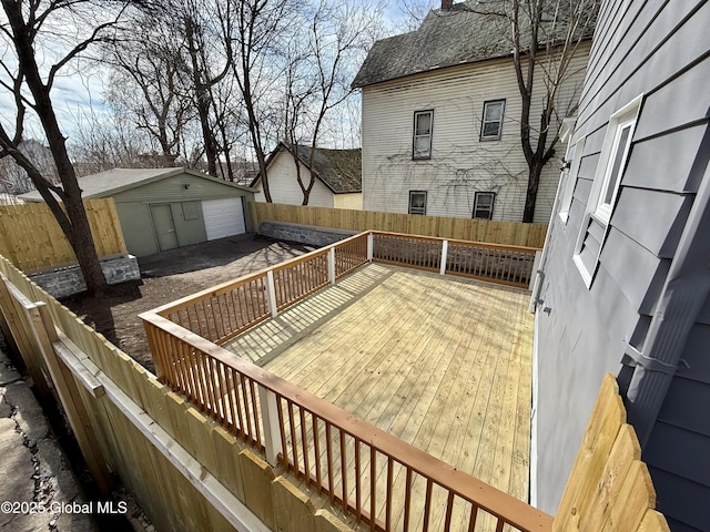 9 Brandt Pl, Amsterdam, NY 12010 - wooden deck featuring an outdoor structure, a fenced backyard, and a garage