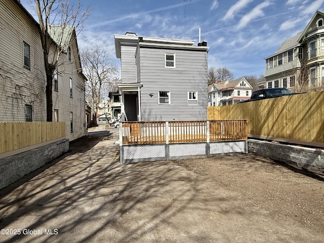 9 Brandt Pl, Amsterdam, NY 12010 - rear view of house with fence and a wooden deck