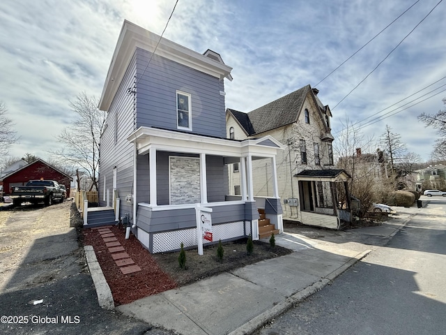 9 Brandt Pl, Amsterdam, NY 12010 - view of front of home with an outbuilding and covered porch