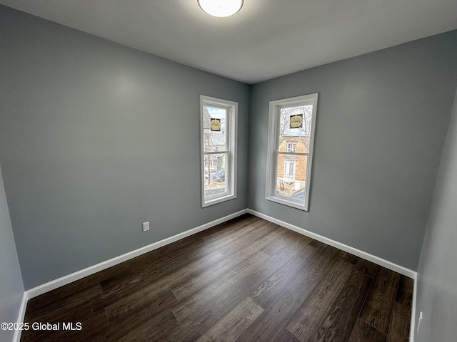 9 Brandt Pl, Amsterdam, NY 12010 - unfurnished room with baseboards and dark wood-style flooring