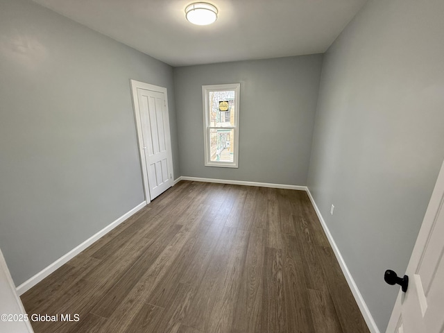 9 Brandt Pl, Amsterdam, NY 12010 - empty room featuring baseboards and dark wood-style flooring