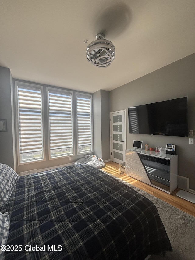 bedroom featuring light wood finished floors