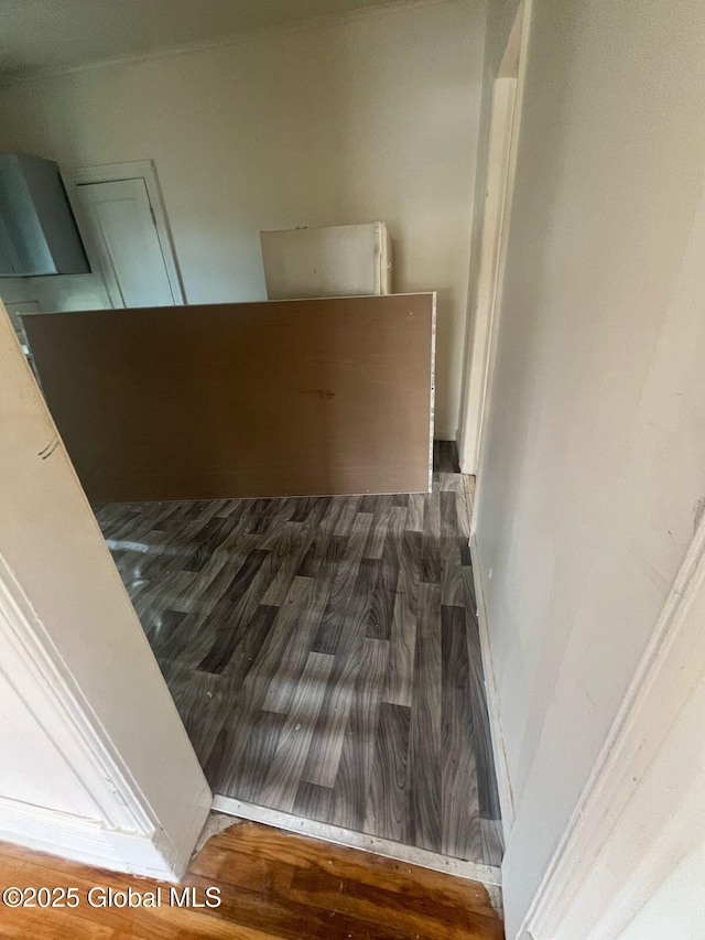 stairway with wood finished floors