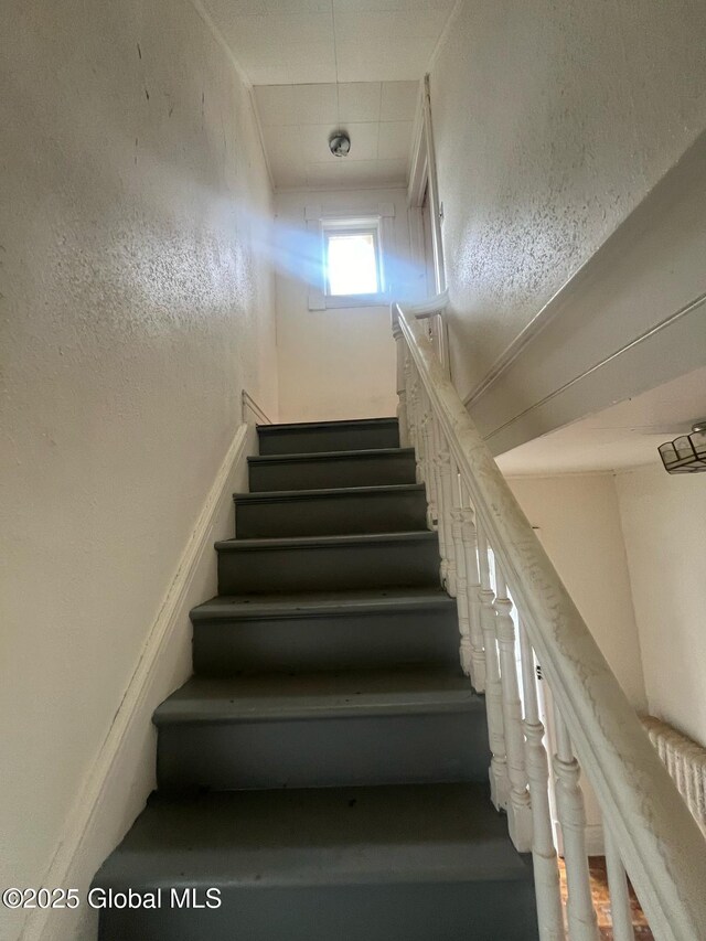 stairs with a textured wall