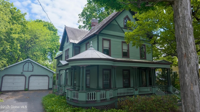14 Pleasant St, Ballston Spa, NY 12020 - victorian house featuring a porch, an outdoor structure, a garage, and a chimney