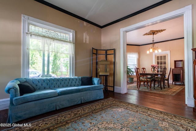 14 Pleasant St, Ballston Spa, NY 12020 - living area featuring ornamental molding, a chandelier, wood finished floors, and baseboards
