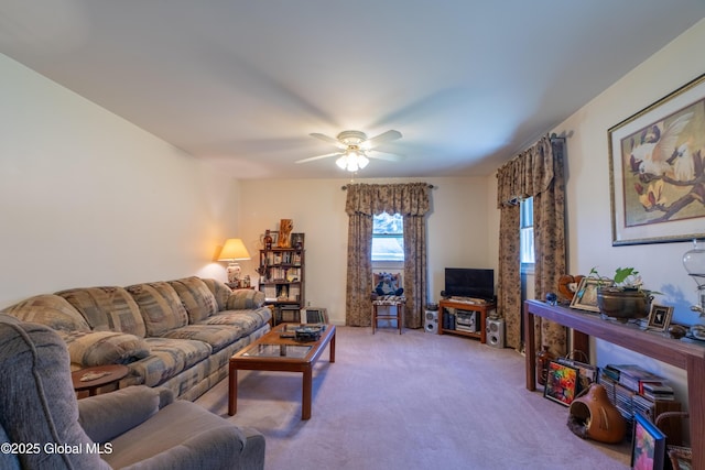 living area featuring carpet floors and a ceiling fan