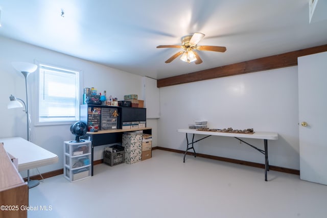 home office with baseboards, ceiling fan, and concrete flooring