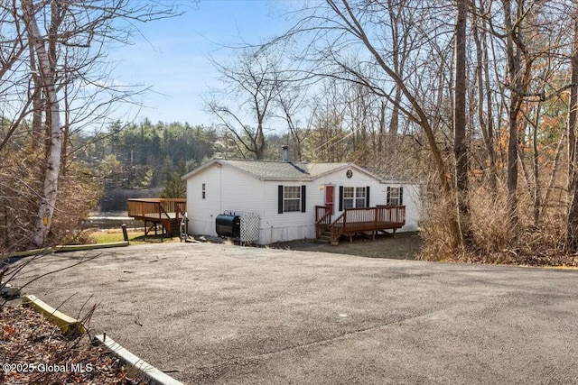 exterior space featuring heating fuel and a deck
