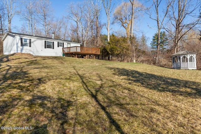 view of yard featuring a gazebo and a wooden deck