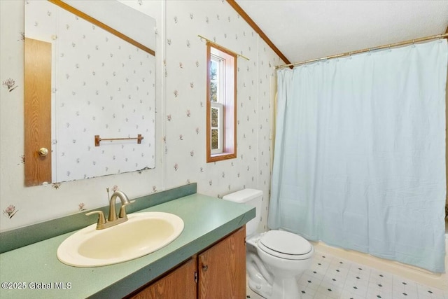 full bath with ornamental molding, wallpapered walls, toilet, tile patterned floors, and vanity