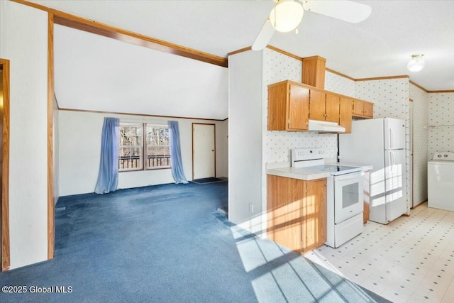 kitchen with crown molding, white appliances, under cabinet range hood, wallpapered walls, and washer / dryer