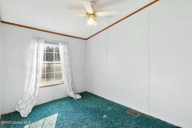 empty room featuring a ceiling fan, carpet floors, and visible vents