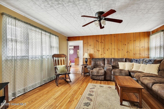 23 Leggett Rd, Ghent, NY 12075 - living area with wooden walls, hardwood / wood-style flooring, and a ceiling fan