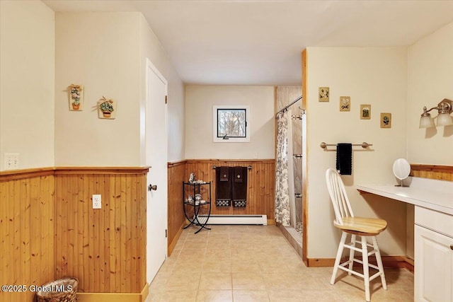 23 Leggett Rd, Ghent, NY 12075 - interior space featuring a shower with curtain, a baseboard radiator, wainscoting, and wooden walls