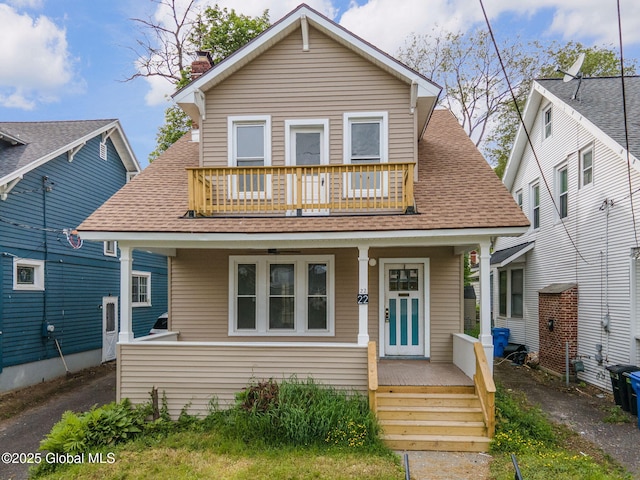 22 Fairlawn Ave, Albany, NY 12203 - view of front of house featuring a balcony, roof with shingles, covered porch, and a chimney