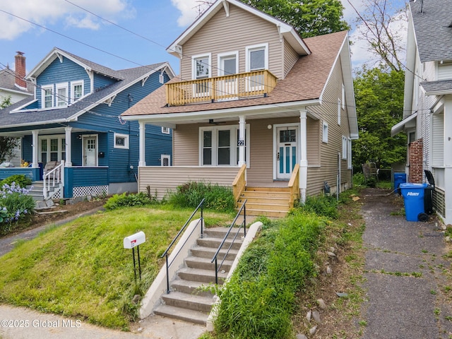 22 Fairlawn Ave, Albany, NY 12203 - view of front of home with covered porch, a balcony, roof with shingles, and stairway