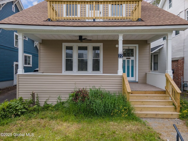 22 Fairlawn Ave, Albany, NY 12203 - bungalow-style home with a shingled roof, a porch, a balcony, and ceiling fan