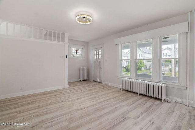 22 Fairlawn Ave, Albany, NY 12203 - empty room featuring radiator heating unit, light wood finished floors, and baseboards