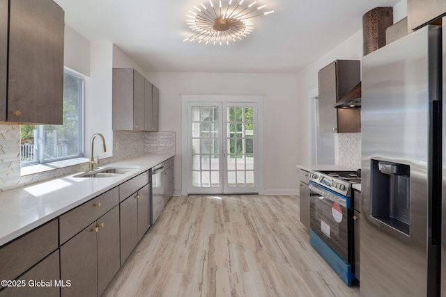 22 Fairlawn Ave, Albany, NY 12203 - kitchen featuring stainless steel appliances, a sink, light wood-style floors, light countertops, and gray cabinetry