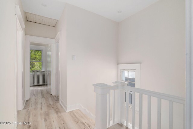 22 Fairlawn Ave, Albany, NY 12203 - hallway with an upstairs landing, light wood-style floors, radiator, and baseboards
