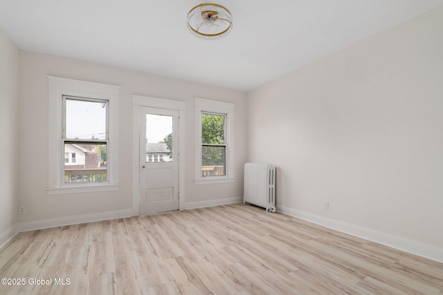 22 Fairlawn Ave, Albany, NY 12203 - spare room featuring radiator, wood finished floors, and baseboards