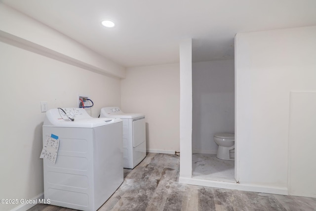 22 Fairlawn Ave, Albany, NY 12203 - laundry area featuring washing machine and clothes dryer, light wood-style flooring, and baseboards