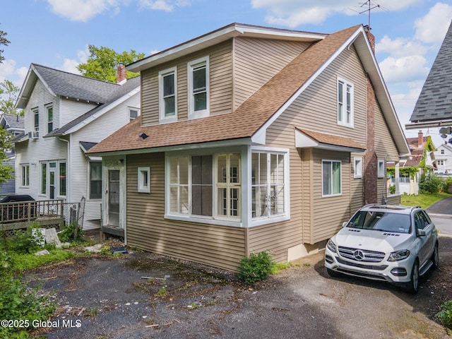 22 Fairlawn Ave, Albany, NY 12203 - view of front of house featuring a shingled roof and a chimney