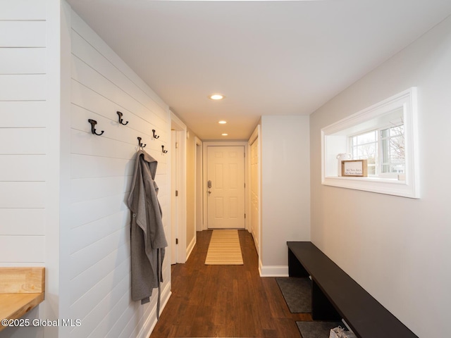 interior space with dark wood finished floors, baseboards, and recessed lighting