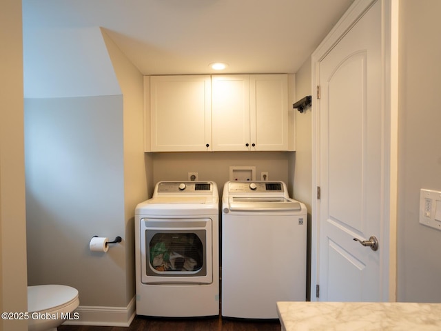laundry area with washing machine and clothes dryer, baseboards, and recessed lighting