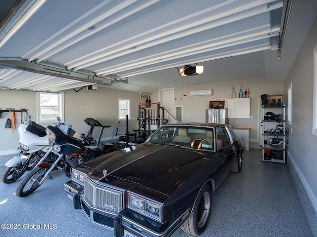 garage featuring freestanding refrigerator, baseboards, and a garage door opener