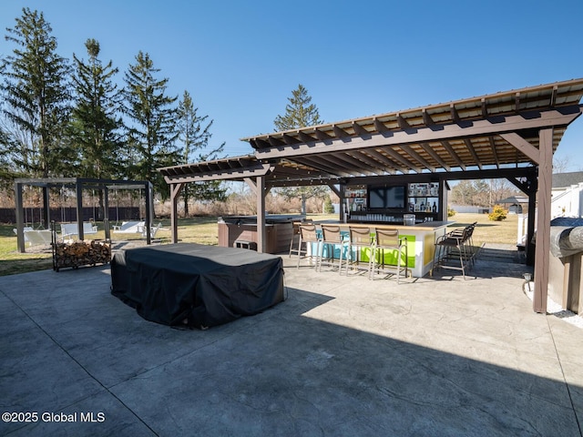 view of patio / terrace featuring a hot tub, outdoor dry bar, grilling area, and a pergola