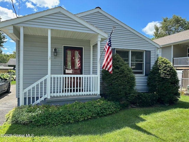 view of front of house with a front lawn and a porch