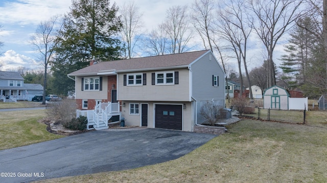 7 Bemis Heights Rd, Saratoga Springs, NY 12866 - bi-level home featuring a garage, aphalt driveway, central air condition unit, and a front lawn