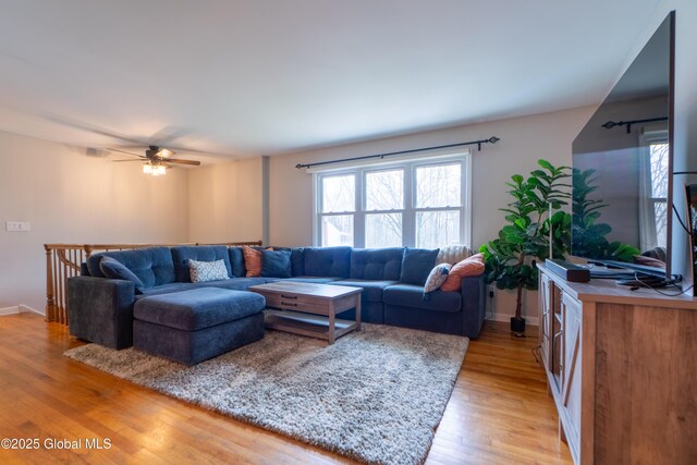 7 Bemis Heights Rd, Saratoga Springs, NY 12866 - living room featuring light wood-style flooring, a ceiling fan, and a wealth of natural light