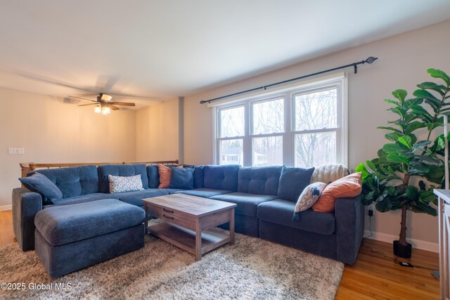 7 Bemis Heights Rd, Saratoga Springs, NY 12866 - living area featuring ceiling fan, wood finished floors, and baseboards