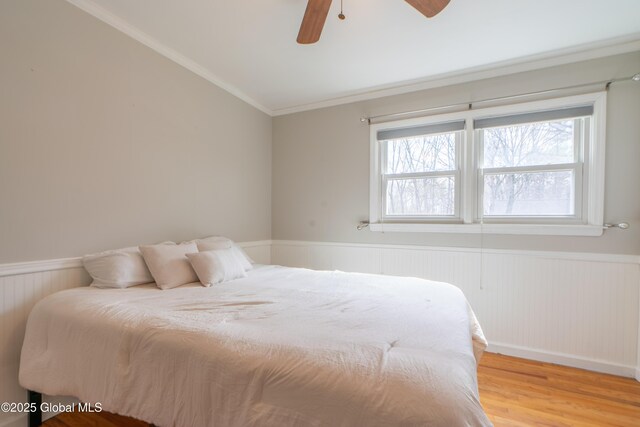 7 Bemis Heights Rd, Saratoga Springs, NY 12866 - bedroom featuring light wood-type flooring, multiple windows, and a wainscoted wall