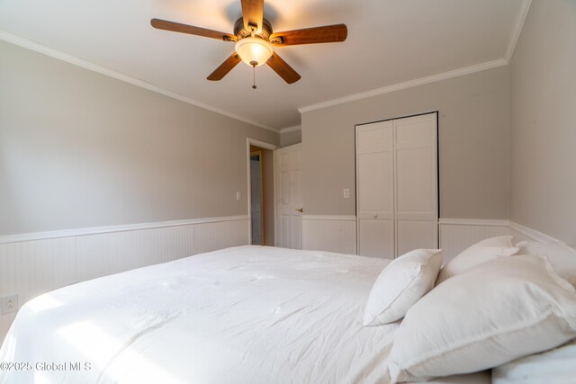 7 Bemis Heights Rd, Saratoga Springs, NY 12866 - bedroom with crown molding, a closet, a ceiling fan, and a wainscoted wall