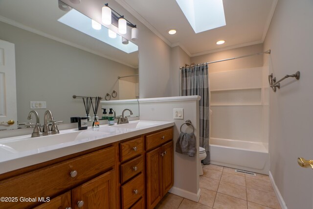 7 Bemis Heights Rd, Saratoga Springs, NY 12866 - bathroom featuring ornamental molding, toilet, a skylight, a sink, and tile patterned floors