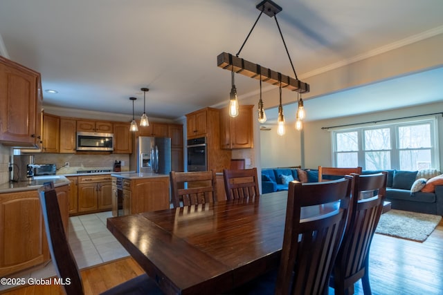 7 Bemis Heights Rd, Saratoga Springs, NY 12866 - dining room featuring ornamental molding and light wood-style flooring