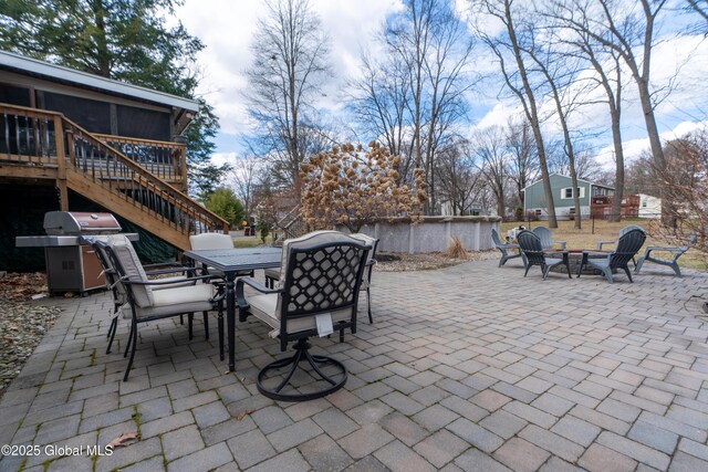 7 Bemis Heights Rd, Saratoga Springs, NY 12866 - view of patio featuring an outdoor fire pit, grilling area, outdoor dining space, stairs, and a wooden deck