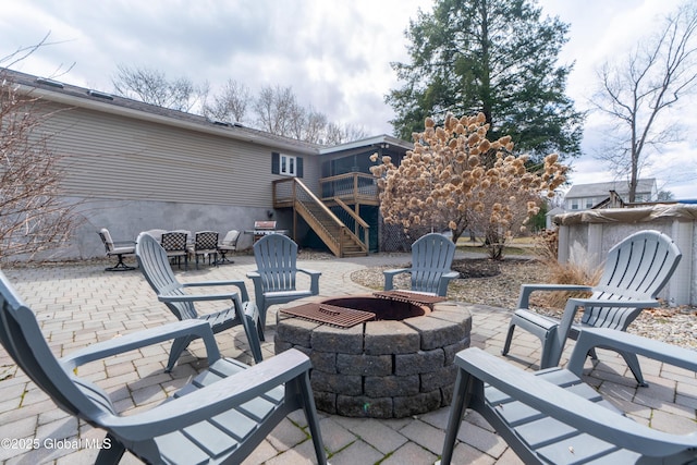 7 Bemis Heights Rd, Saratoga Springs, NY 12866 - view of patio featuring a deck, a fire pit, and stairs