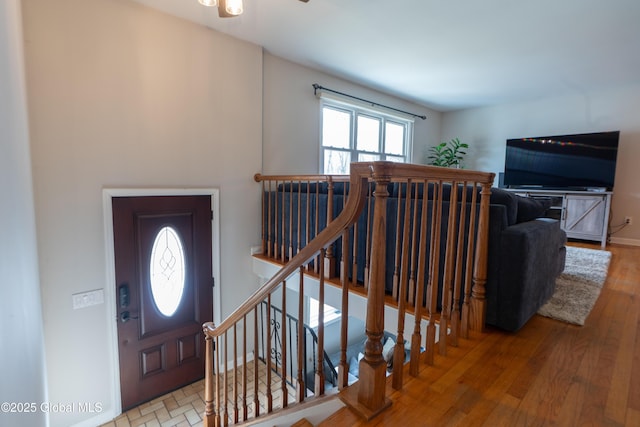 7 Bemis Heights Rd, Saratoga Springs, NY 12866 - entryway featuring stairs, ceiling fan, baseboards, and wood finished floors