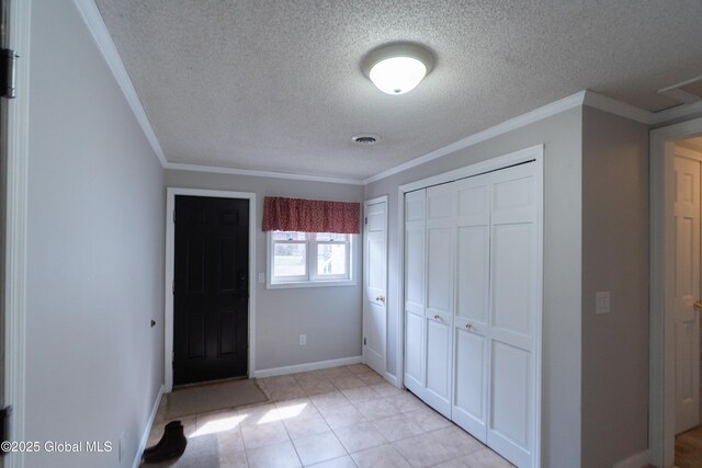 7 Bemis Heights Rd, Saratoga Springs, NY 12866 - unfurnished bedroom with visible vents, baseboards, a closet, ornamental molding, and a textured ceiling